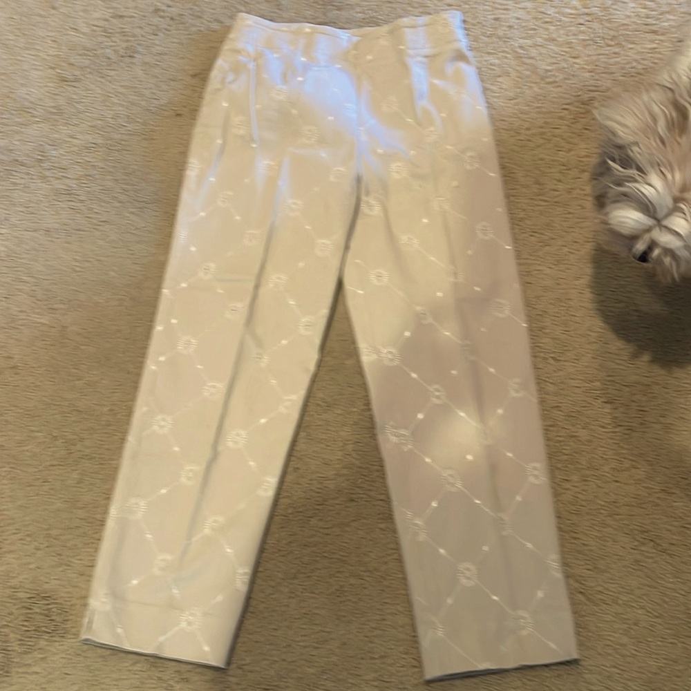 Tan cotton capris with eyelet design.